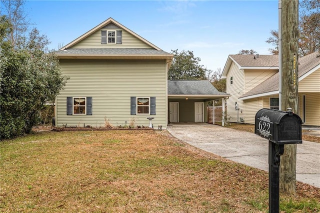 view of property exterior featuring a carport and a lawn