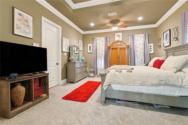 carpeted bedroom with crown molding and ceiling fan