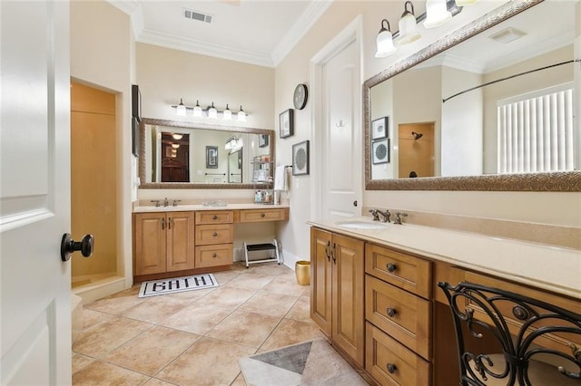 bathroom with tile patterned flooring, crown molding, a shower, and vanity