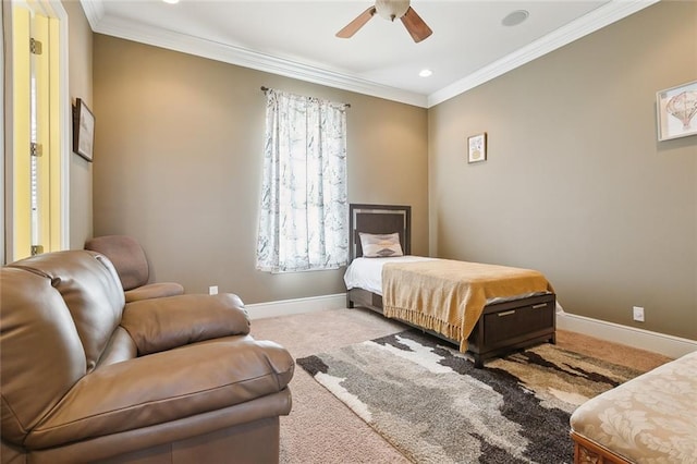 bedroom with ornamental molding, ceiling fan, and carpet