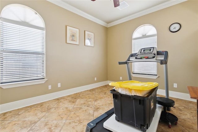 exercise area featuring ceiling fan, ornamental molding, and tile patterned floors