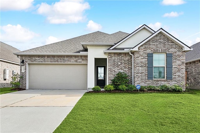 view of front facade with a garage and a front yard