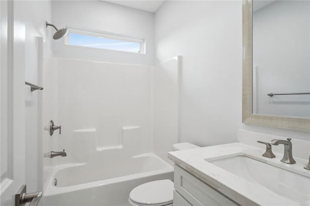 bathroom featuring vanity, toilet, and shower / bath combination