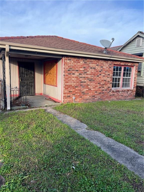 view of property exterior with a lawn