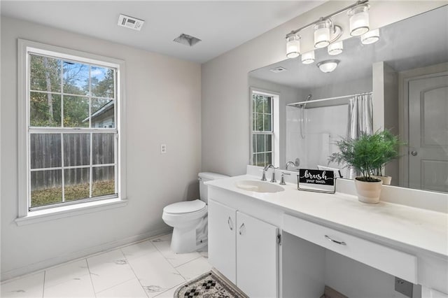 bathroom featuring vanity, toilet, and a shower with curtain