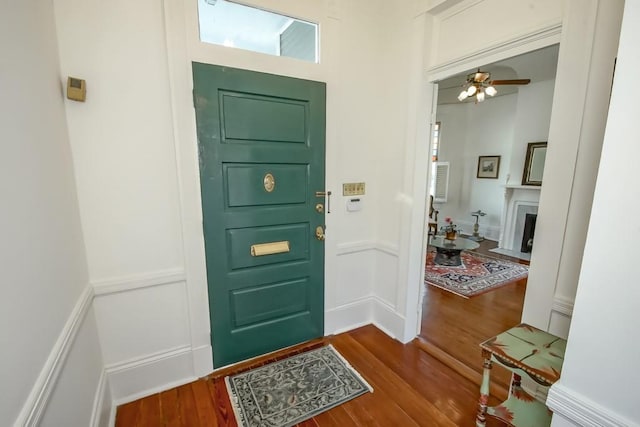 entrance foyer featuring wood-type flooring and ceiling fan