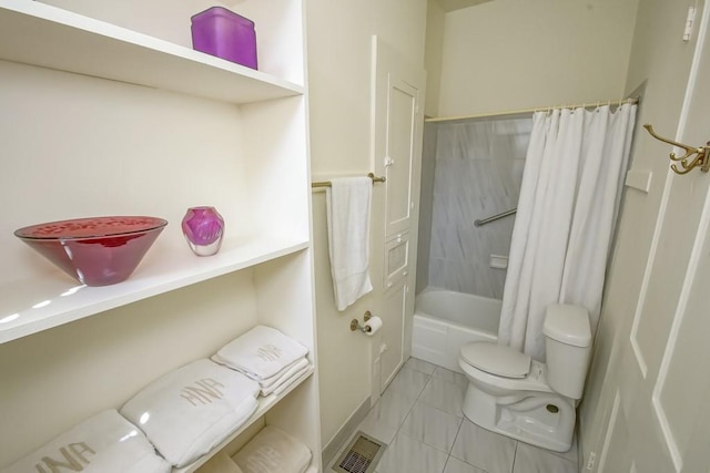 bathroom featuring shower / bath combination with curtain and toilet