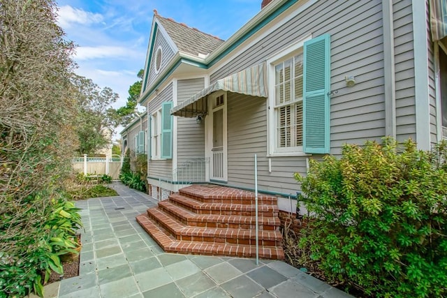 property entrance featuring a patio area