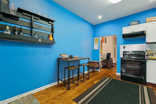 kitchen featuring white cabinetry, electric range, and dark hardwood / wood-style floors