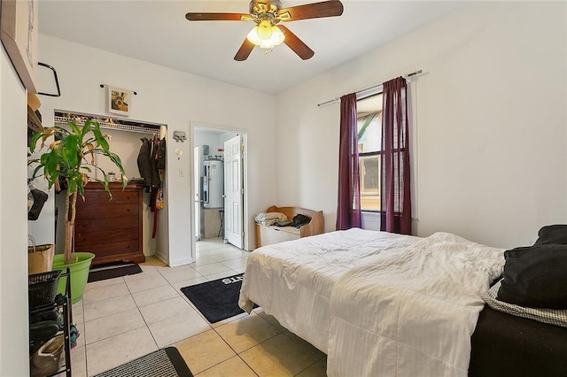 bedroom featuring light tile patterned floors and ceiling fan