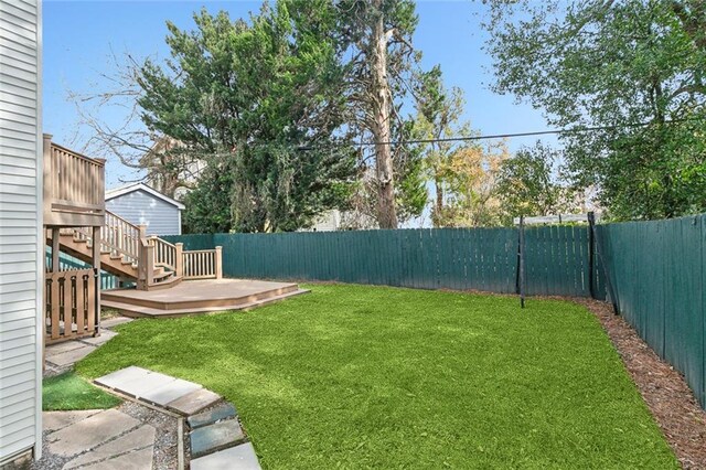 view of yard featuring a wooden deck