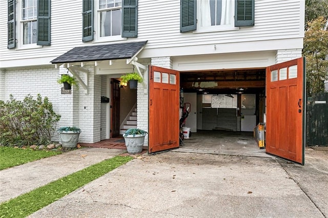 doorway to property featuring a garage