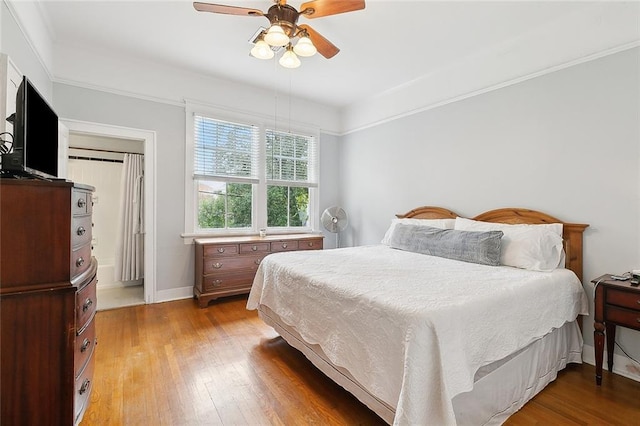 bedroom featuring ceiling fan and light hardwood / wood-style floors