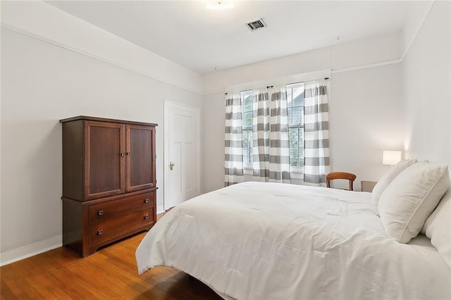 bedroom with light hardwood / wood-style floors