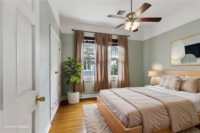 bedroom featuring ceiling fan and light wood-type flooring