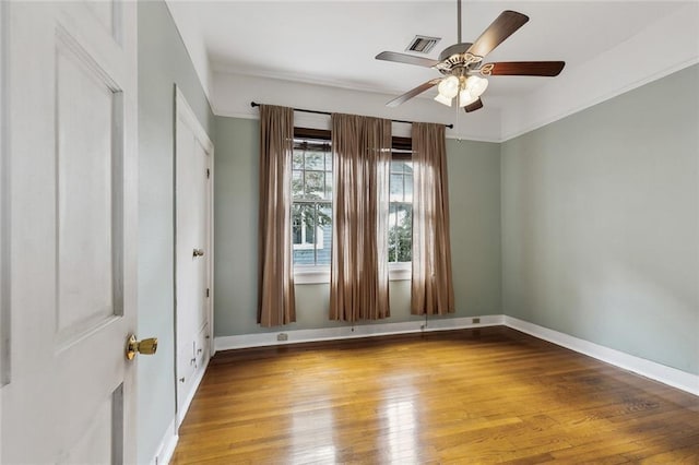 spare room with ceiling fan and hardwood / wood-style floors