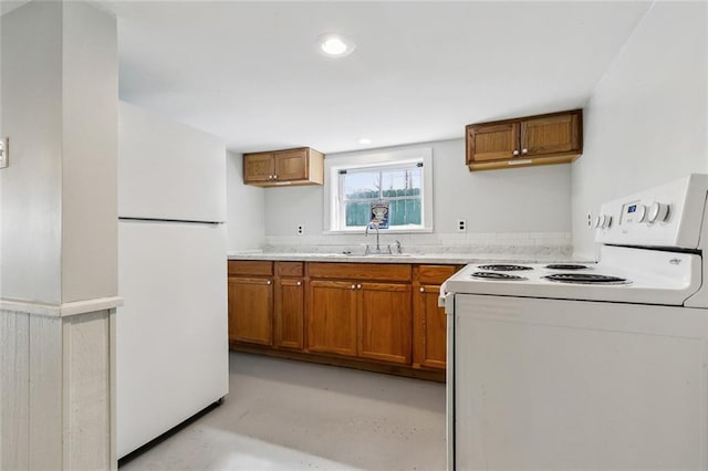 kitchen with sink and white appliances