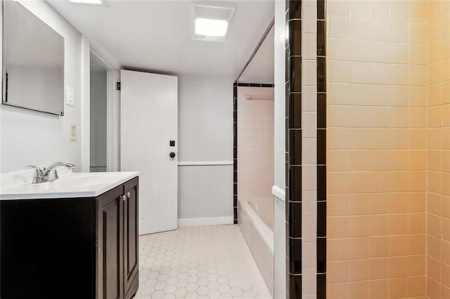 bathroom with tile patterned flooring and vanity