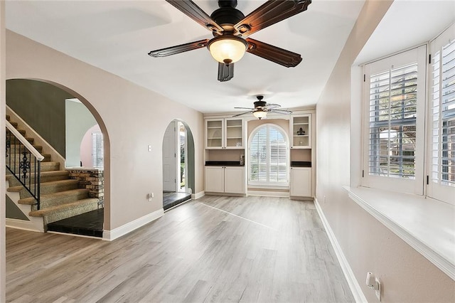 interior space with ceiling fan and hardwood / wood-style floors