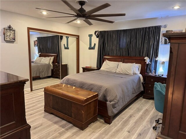 bedroom with light hardwood / wood-style flooring and ceiling fan