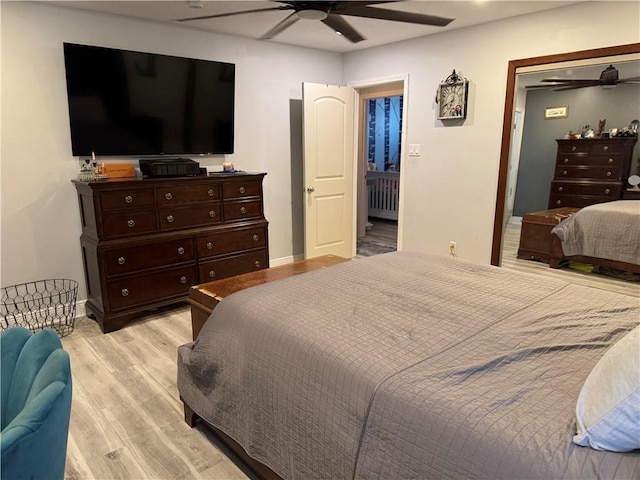 bedroom with ceiling fan and light wood-type flooring