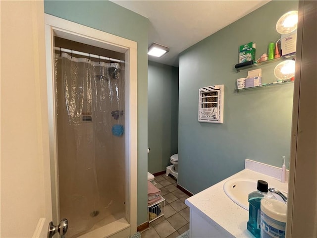 bathroom with vanity, tile patterned flooring, curtained shower, and toilet