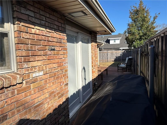 view of side of property featuring a wooden deck