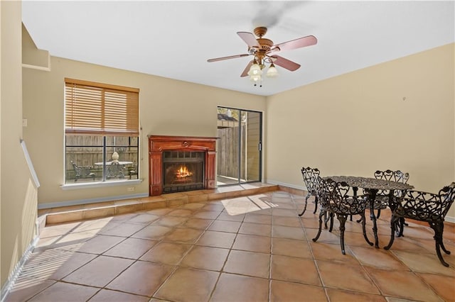 tiled dining area featuring a wealth of natural light and ceiling fan