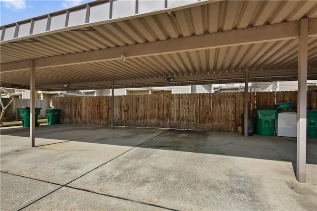 view of vehicle parking featuring a carport