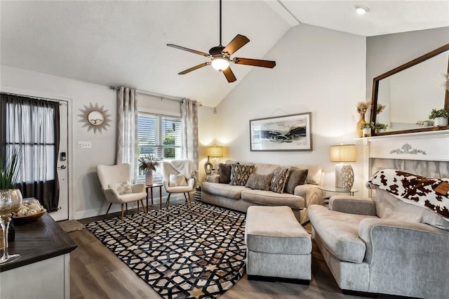 living room featuring ceiling fan, wood-type flooring, and high vaulted ceiling