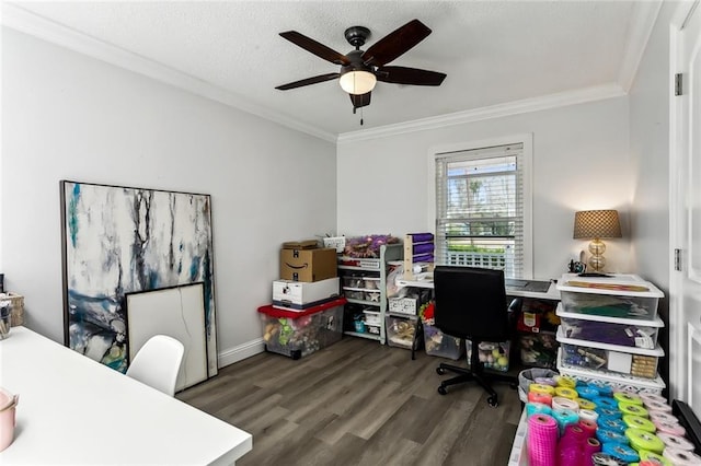 office space with dark wood-type flooring, ceiling fan, and crown molding