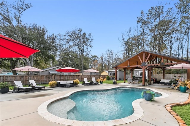 view of pool featuring a gazebo, an outdoor hangout area, and a patio area