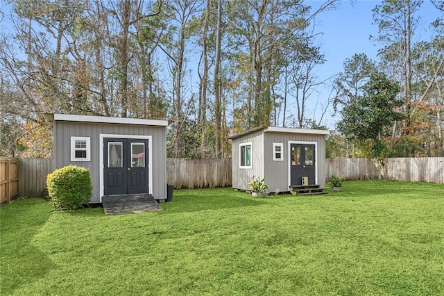 view of outbuilding featuring a lawn