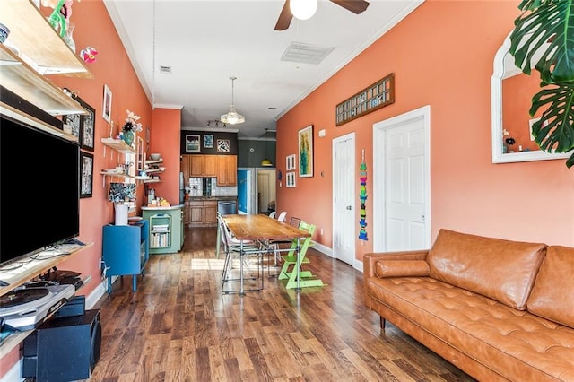 living room featuring crown molding, ceiling fan, and dark hardwood / wood-style flooring