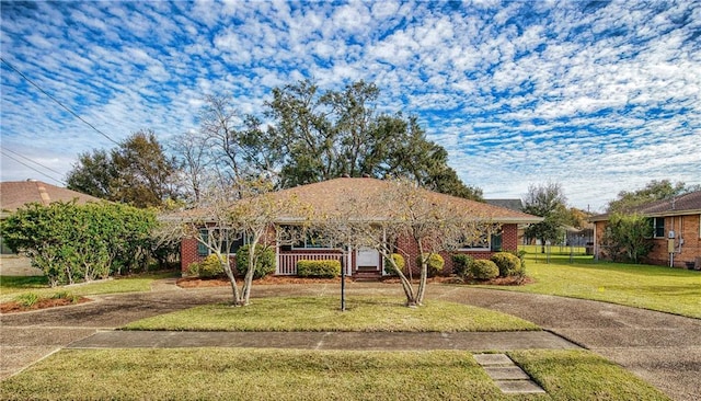 ranch-style house with a front lawn