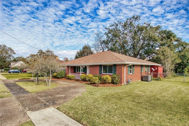 single story home with a front yard and central AC unit