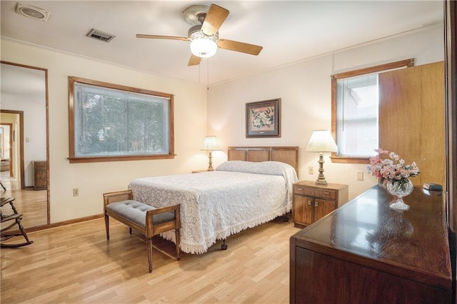 bedroom with ceiling fan and light hardwood / wood-style flooring