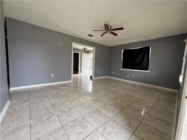 unfurnished room featuring dark wood-type flooring and ceiling fan