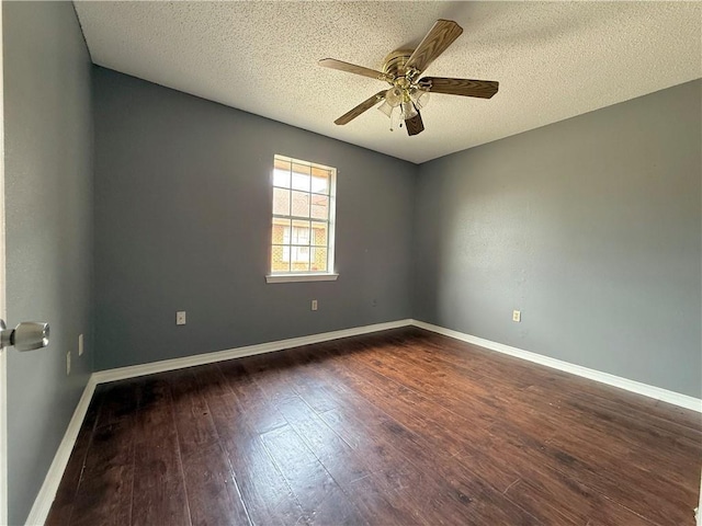 unfurnished room featuring a textured ceiling, dark hardwood / wood-style floors, and ceiling fan