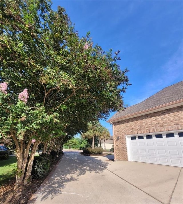 view of property exterior with a garage