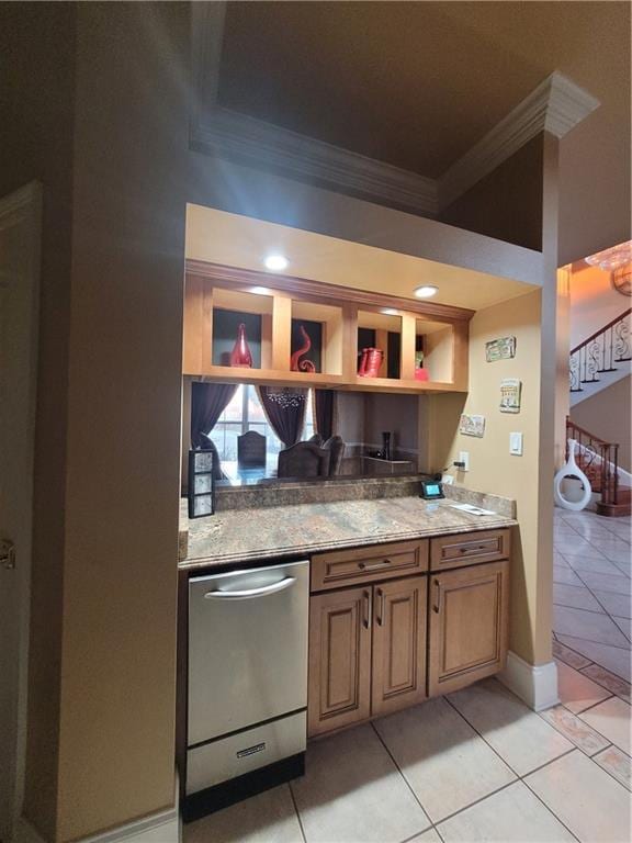 kitchen with light tile patterned flooring, ornamental molding, dishwasher, and light stone countertops