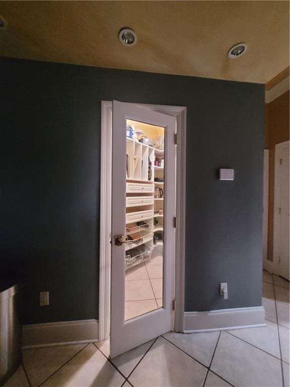 doorway to outside featuring light tile patterned floors