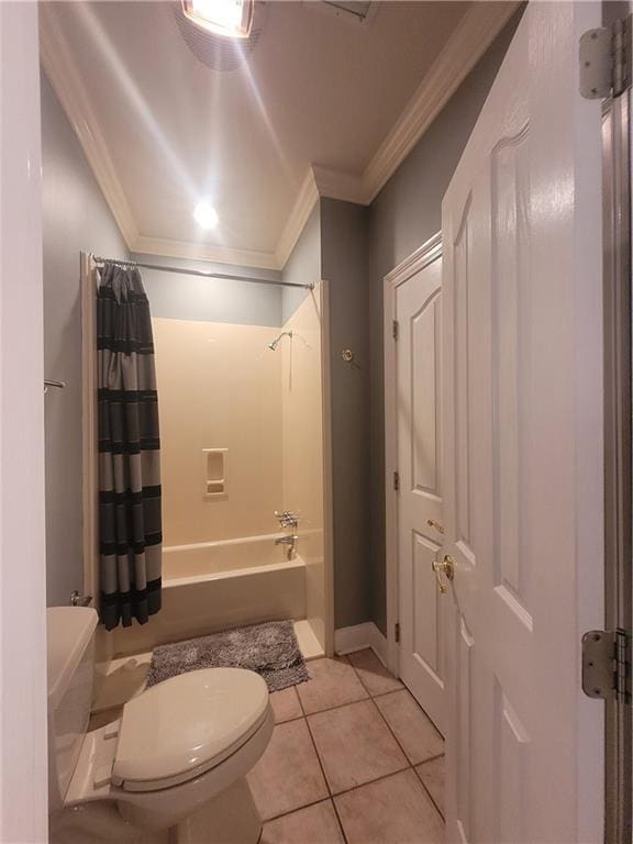 bathroom featuring crown molding, shower / tub combo, tile patterned floors, and toilet