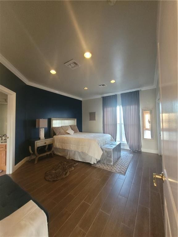 bedroom featuring ornamental molding and dark hardwood / wood-style floors