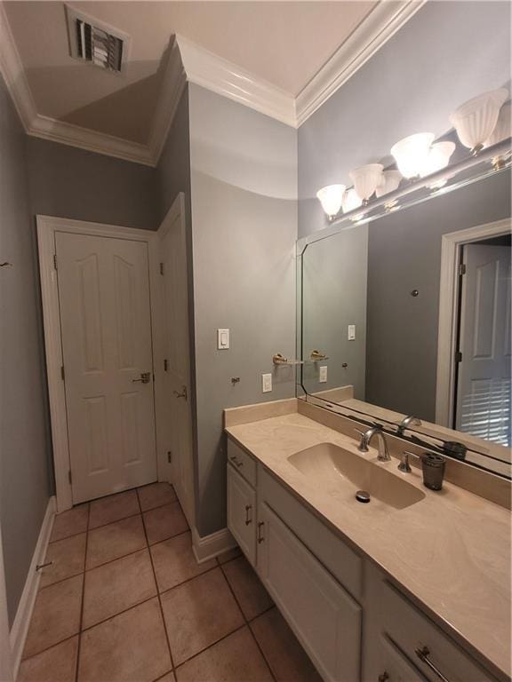 bathroom featuring vanity, tile patterned floors, and ornamental molding