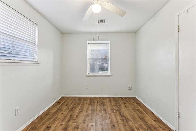 empty room featuring hardwood / wood-style floors and ceiling fan