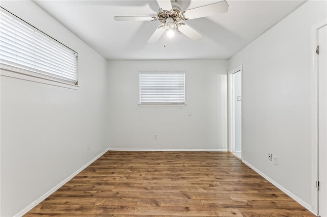 empty room featuring wood-type flooring and ceiling fan