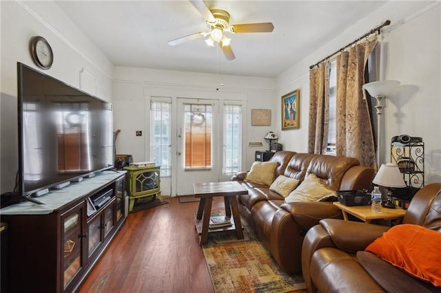 living area featuring dark wood-style floors and ceiling fan