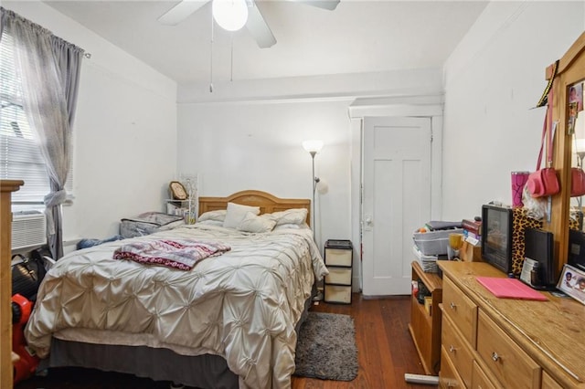 171315 8th St, New Orleans, LA 70115 - bedroom featuring dark wood-type flooring, cooling unit, and a ceiling fan
