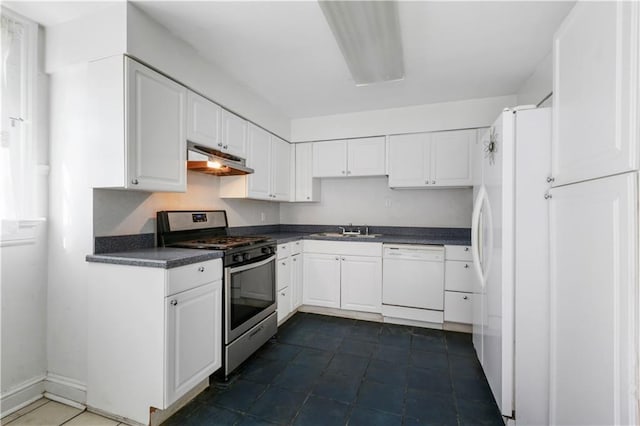 kitchen with dishwasher, sink, dark tile patterned flooring, white cabinets, and gas stove